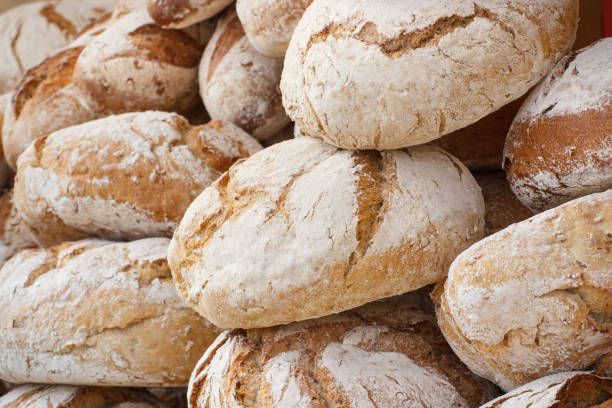 istock Fresh loaves of rye or wheat bread 1296085863