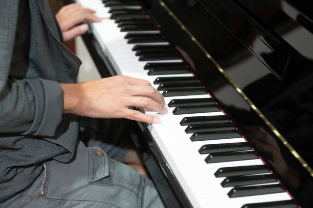 istock The hand that is playing the piano keys 1296090841