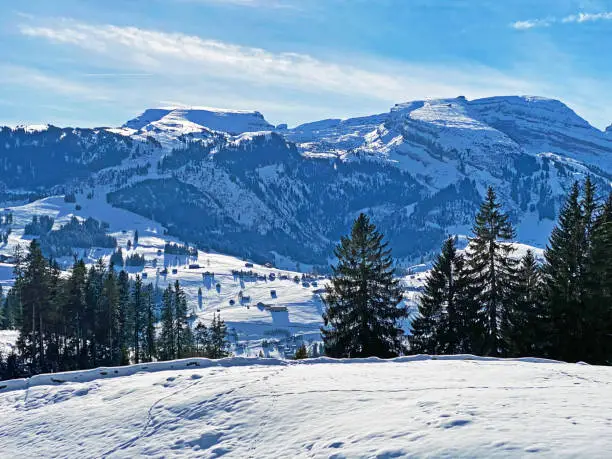 Fantastic winter atmosphere on the alpine peaks Gamserrugg, Chäserrugg (Chaeserrugg or Chaserrugg) and Hinderrugg above the Thur river valley, Unterwasser - Canton of St. Gallen, Switzerland (Schweiz)