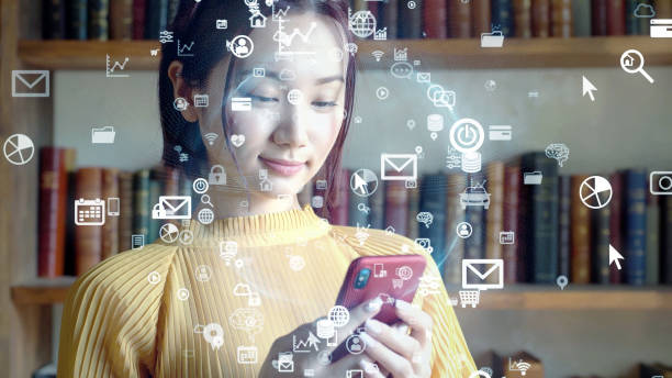 istock Young asian woman using a smart phone. Communication network concept. IoT (Internet of Things). Telecommunication. 1296093662