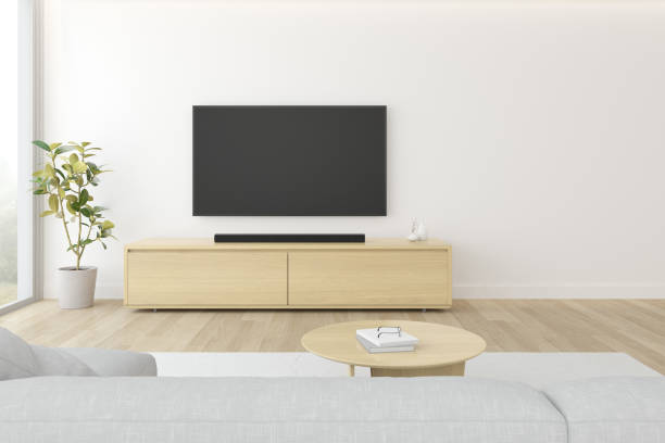 istock 3D rendering of modern living room with sofa and hanging television screen on white wall. 1296093677