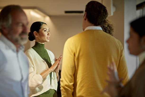 istock Informal Discussion between Business Professionals 1296093704