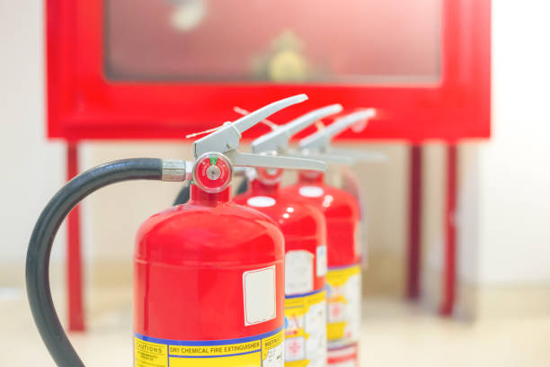 istock Red fire extinguishers available in fire emergencies,safety concept. 1296097069