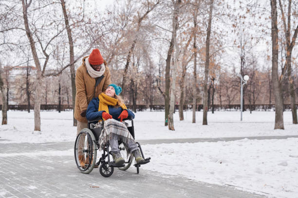 Disabled woman with assistant