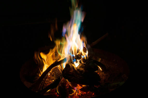 istock Burning campfire with colourful flames at night 1296099835