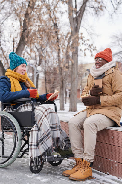 istock Two friends sitting in the park 1296099877