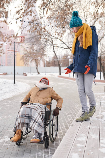 istock Young people walking in the park 1296099974