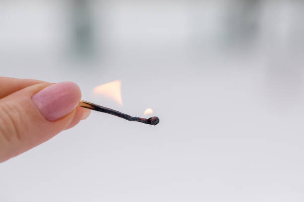 istock Several matches are burned in the woman's hands. 1296099993