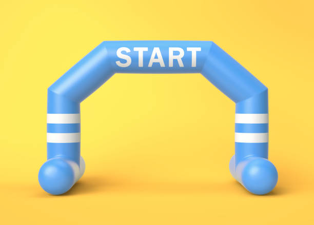 istock Blue and white inflatable start line arch on yellow background 1296100426