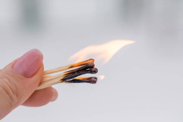 istock Several matches are burned in the woman's hands. 1296100571