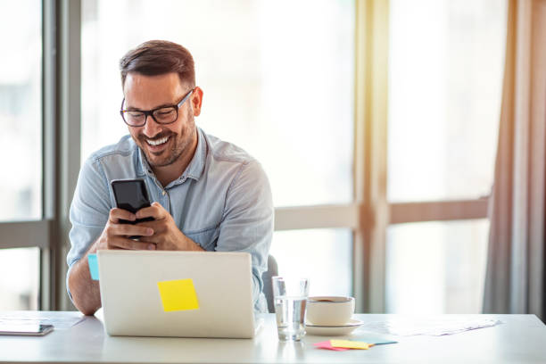 Young businessman in office working on laptop