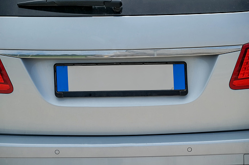 Empty european license plate on the back of a white van, close up photo.