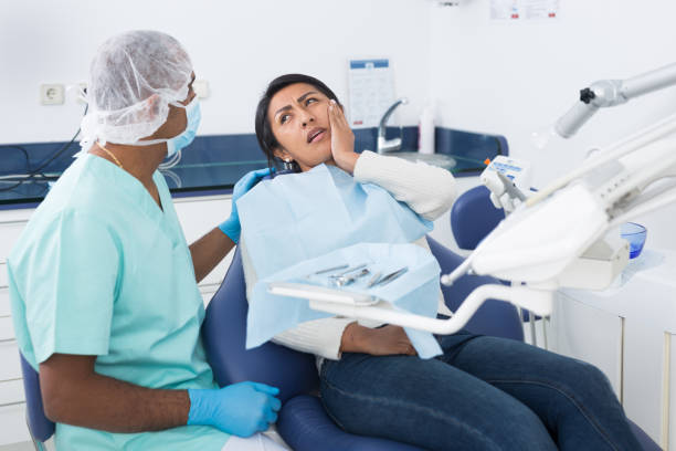 istock Professional doctor man talking with patient in chair 1296105473