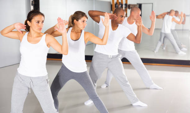 istock Men and women train in self defense courses in gym 1296106919