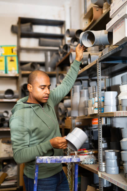 istock Hispanic man looking for construction supplies in building hypermarket 1296106948