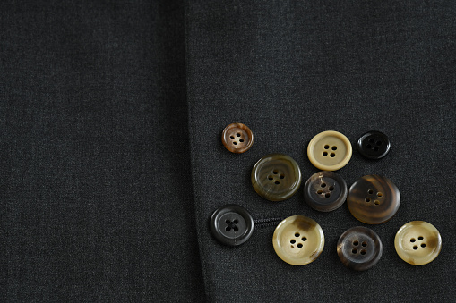 Button on the striped white fabric clothing