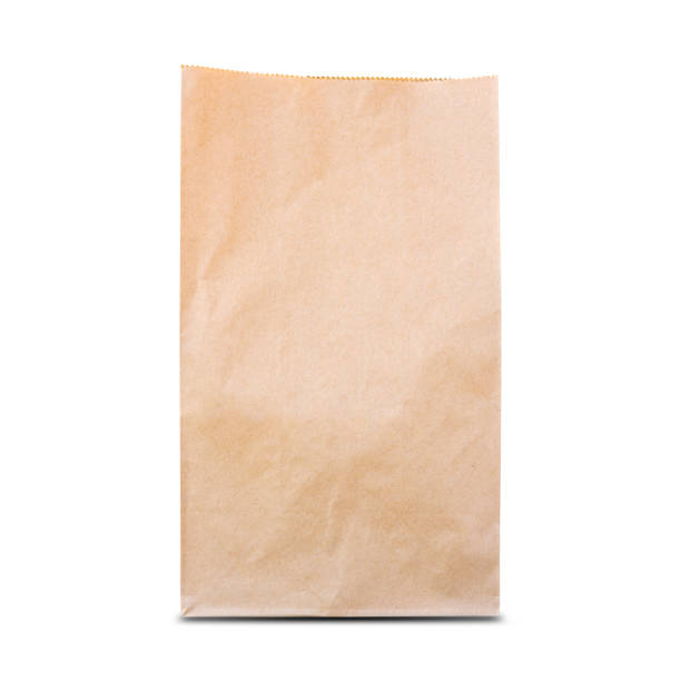 istock Brown paper bag isolated on white background. 1296107945