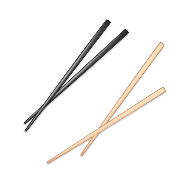 istock Realistic black and light wooden glossy chopsticks. Chopstick element Asian or oriental traditional culture. Vector isolated on white 1296108749