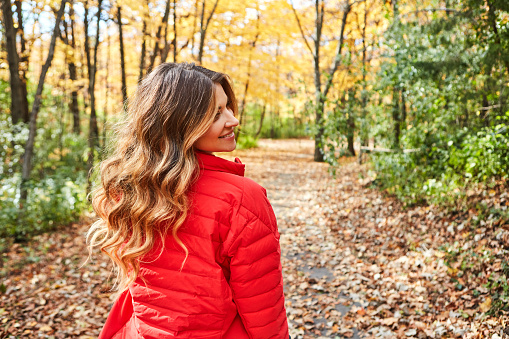 Cropped shot of an attractive young woman in the forest during autumn