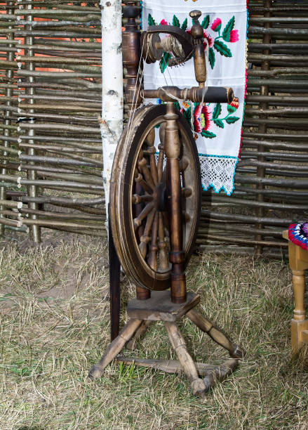 istock Antique wooden spinning wheel 1296111324
