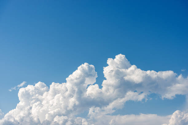 istock White Clouds in a Clear Blue Sky - Cumulonimbus 1296112507