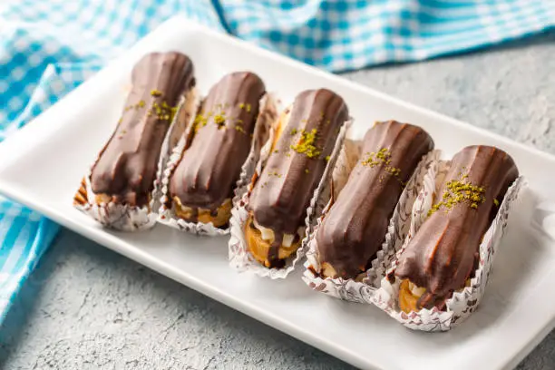 Traditional french eclairs with chocolate.