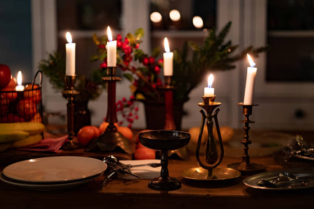 istock candlesticks with candles on wooden table.romantic setting for dinner in kitchen 1296113878