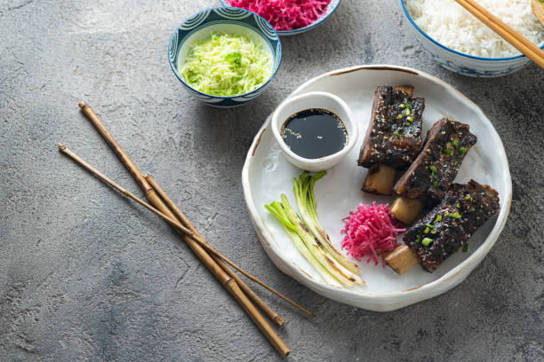 istock Smoked sticky beef short ribs with radish and rice, copy space 1296113882