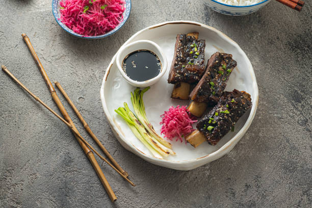 istock Smoked sticky beef short ribs with radish and rice, copy space 1296113893