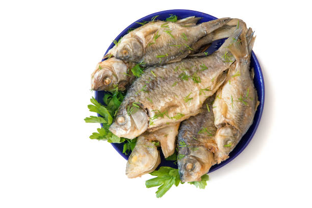 istock Carp fried in sour cream with dill and parsley 1296114237