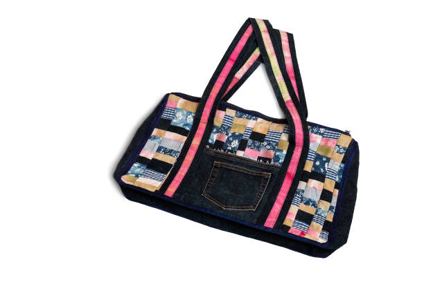 istock Bag made of fabric patchwork on a white background. 1296114266