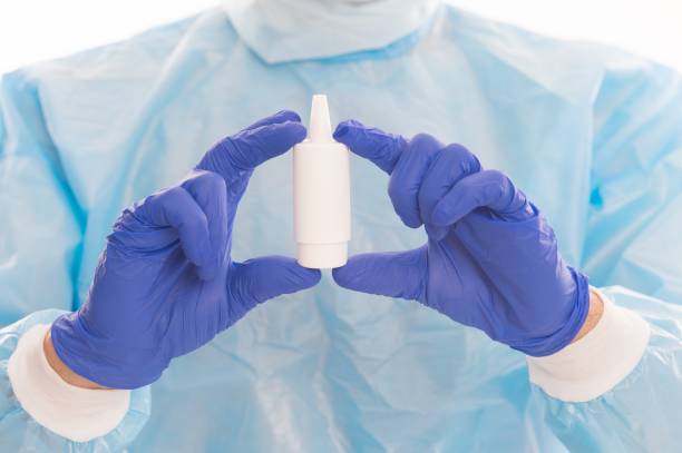 istock Vaccine against covid-19. Medicine container in gloves. Selective focus. Vaccine development. 1296117739