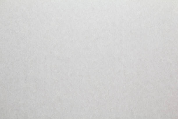 istock Grey sheet of kraft paper texture background. Gray cardboard. Copy space for text. 1296117809