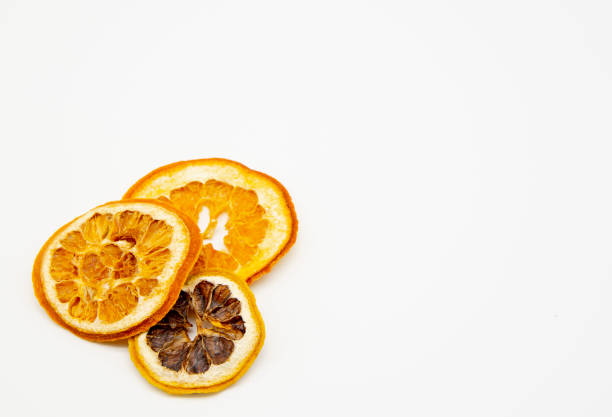 istock A few dried orange slices on a white background. 1296119853