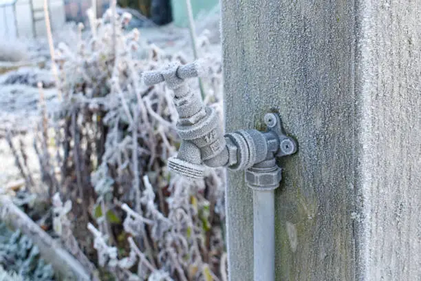 Photo of close up of outdoor water tap covered in frost