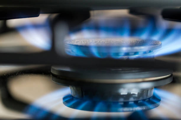 istock Gas hob in the kitchen with blue flames burning 1296120271