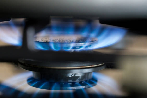 istock Gas hob in the kitchen with blue flames burning 1296120275