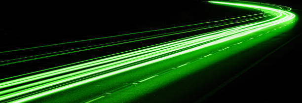 istock green car lights at night. long exposure 1296121337