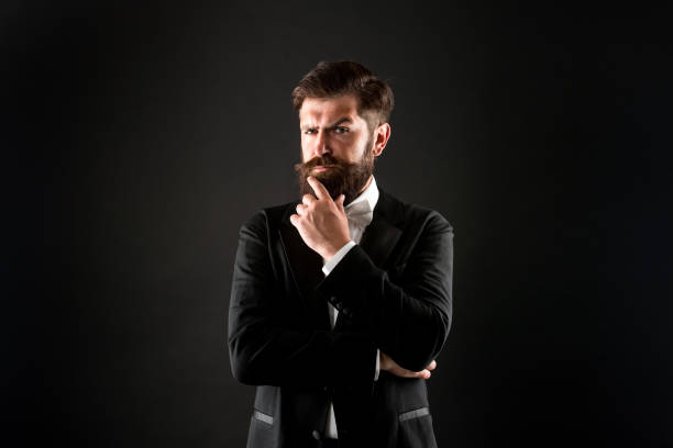 istock The beard trend will never truly be gone. Serious groom touch beard. Unshaven hipster with textured beard hair. Bearded man with stylish mustache and beard shape. Barbershop. Barbers salon 1296121945