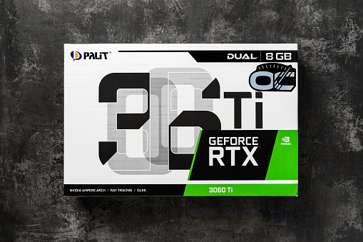 Varna, Bulgaria, January 08, 2021. Palit Nvidia Geforce RTX 3060 Ti Dual OC 8GB gaming graphics card box on a dark background. Modern desktop computer hardware components for build and upgrade. Top view.