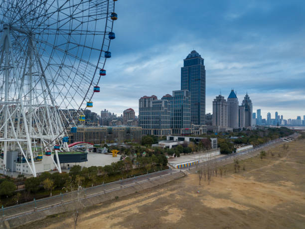 istock An empty road under the ferris wheel in a city park 1296124872