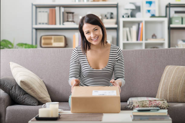istock Woman receiving a parcel 1296125651
