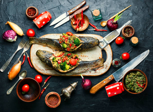 istock Baked fish stuffed with vegetables 1296127260