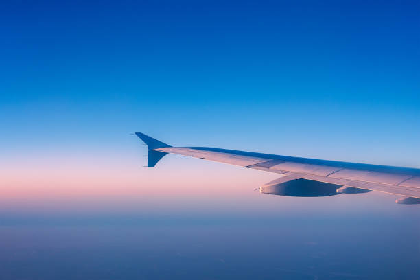 istock Wing of an airplane in the air 1296127613