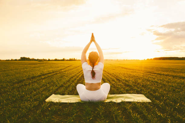 istock Curvy girl doing yoga in nature. 1296128989