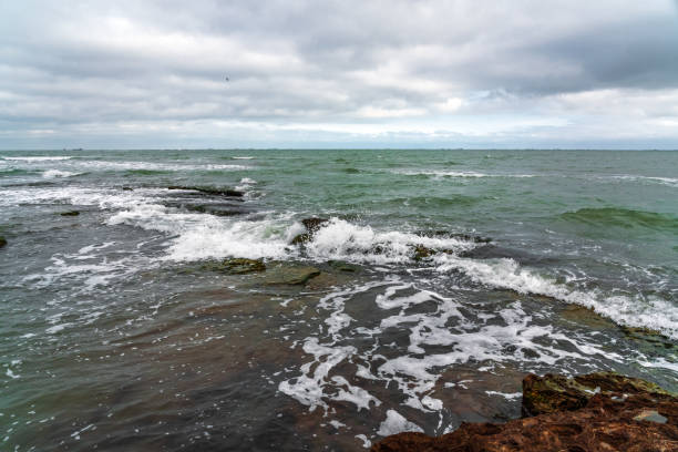 istock Wave splashing at the rocks, freshness on beach 1296129242
