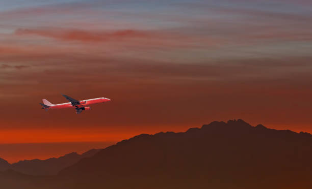 istock Airplane taking off above colorful clouds and mountains 1296131056