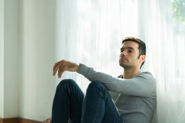 istock Working men are under stress from working at home during the virus outbreak. Young businessman working from home. The young man was sitting and physically from a lock down due to viral conditions. 1296132326