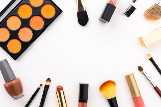 istock Plenty of makeup on the white table with eyelash brush, eye shadow, lipstick with copy space for text. 1296134707