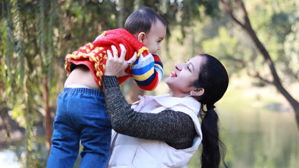 istock Mother playing with her baby daughter 1296134873